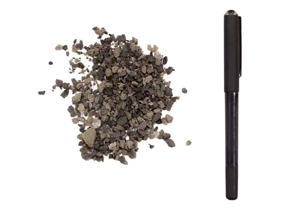 Black River Sand - Showing scale of stones next to a pen